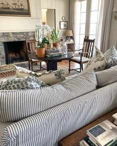 a living room filled with furniture and a fire place