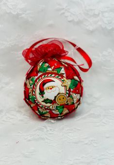 a red ornament with santa clause on it