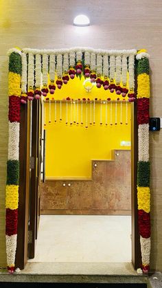 an entrance decorated with flowers and garlands