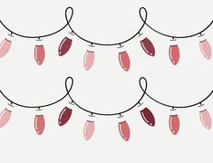 several red and pink lights hanging from a wire