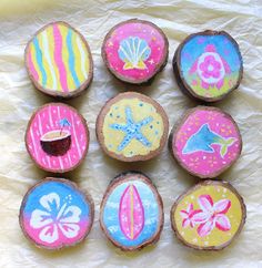 painted wood slices with different designs on them