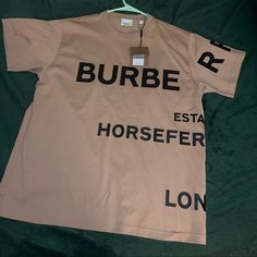 Sz Small Burberry T-Shirt Brown Crew Neck T-shirt With Logo Print, Brown Graphic Tee With Logo Print, Beige Graphic Tee With Logo Print, Burberry Print, Burberry T Shirt, Burberry Shirts, Burberry Shirt, Pocket Tee Shirts, Pullover Shirt