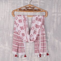 Against a body of snow white, a blissful array of motifs in burgundy are block-printed by hand onto this cotton wrap scarf from India. Rajnandinee and Srabonti design this scarf, which is crafted by local artisans. Tassels dangle from each end. Block Print Motifs, Print Motifs, Handcrafted Handbags, Embroidered Shirt Dress, Indian Arts And Crafts, Woven Scarves, Indian Block Print, Silk Shawl, Wrap Scarf