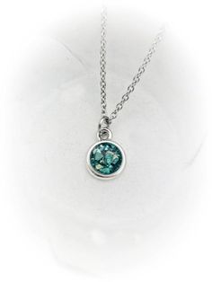 This beautiful, dainty necklace is made using your beloved pet's actual ashes. You may or may not be able to see the ashes, as I add a touch of glitter to highlight the piece. If it is important for you to see the ashes, please state this in a note during checkout.The rhodium plated silver disc pendant is approximately 1/2" and graces a dainty stainless steel link chain. The stone color in photo 1 is a clear stone with the ashes visible. All ashes vary in color. This is only an example.  Please Pet Cremation Jewelry, Cremation Ring, Ashes Necklace, Cremation Necklaces, Memorial Ring, Pet Memorial Jewelry, Pet Cremation, Ashes Jewelry, Pet Loss Gifts