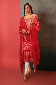 Red kurta with bandhani woven motifs and gota embroidered neckline. Paired with embroidered dupatta.
Components: 2
Pattern: Woven, Embroidery
Type Of Work: Bandhani, gota
Neckline: U neck
Sleeve Type: Three quarter
Fabric: Silk
Color: Red
Other Details: 
Cutwork border
Attached lining
Kurta Length: 47 inches
Note: Pant worn by the model is not for sale
Occasion: Sangeet - Aza Fashions Luxury Red Bandhani Print Salwar Kameez, Red Chanderi Unstitched Suit With Dabka Work, Semi-stitched Dola Silk Salwar Kameez With Bandhani Print, Semi-stitched Bandhani Print Salwar Kameez In Dola Silk, Unstitched Chanderi Sharara With Bandhani Print, Dola Silk Salwar Kameez With Bandhani Print For Navratri, Red Chanderi Dupatta With Dabka Work, Festive Designer Bandhani Salwar Kameez, Festive Bandhani Print Anarkali