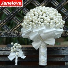 a bridal bouquet and boutonniere on a bench