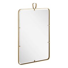 The Martinelli rounded rectangle decorative vanity mirror blends modern with industrial design for a unique accent in your bathroom, bedroom, or hallway. An iron-faceted frame adorns the rounded rectangular mirror for a delicate look with a touch of edge and lasting durability. A small loop for hanging adds a functional yet unique touch. Finish: Satin Brass Signature Hardware Martinelli 39-5/8" x 24" Framed Bathroom Mirror - Wall & Accent Mirrors in Satin Brass | Size 39.63" H X 24" W X 1" D | P Champagne Bronze Medicine Cabinet, Mirror For 42” Vanity, Satin Brass Vanity Lighting, Gold Mirror Bathroom 48", Bathroom Medicine Cabinet Mirrors 26" X 36", Wall Accent, Rounded Rectangle, Mirror Wall Bathroom, Signature Hardware