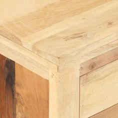 a close up view of the top of a wooden table with wood grains on it