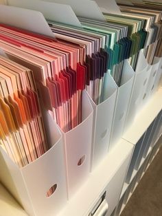 many folders are stacked on top of each other in this office file organizer system