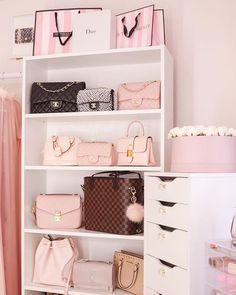 a white shelf filled with purses and handbags