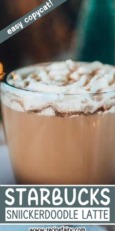 a close up of a cup of hot chocolate with marshmallows on top