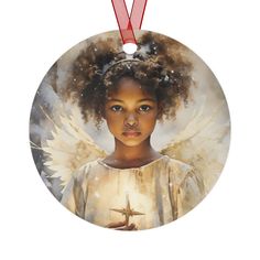 a round ornament with an angel on it's side and a red ribbon around the neck