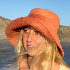 "A wide brim bucket hat for sun lovers and beach fun.  This rust corduroy hat for women has a nice wide brim to protect your whole face and even your neck and chest.  Easy to bring along in your bag, a packable sun hat. A great outdoor style accessory. This hat is made from a rust colored cotton corduroy fabric.  Inside liner is white cotton.  I used interfacing inside the brim to keep it's shape. Brim measures 4.5\" Crown depth is 3.5\". Contact me for custom fit option. SIZES AVAILABLE S - mea Adjustable Orange Sun Hat For Summer, Adjustable Summer Sun Hat In Orange, Adjustable Orange Summer Sun Hat, Summer Orange Adjustable Sun Hat, Orange Cotton Bucket Hat For Summer, Summer Orange Cotton Bucket Hat, Adjustable Solid Color Bucket Hat For Beach Season, Adjustable Solid Color Bucket Hat For Beach, Adjustable Orange Cotton Bucket Hat