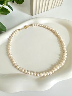 Delicate Wedding Necklaces With Round Beads, Delicate Round Bead Necklaces For Wedding, Delicate White Round Bridal Necklace, Dainty Single Strand Beaded Necklace For Wedding, Cream Pearl Necklace With Round Beads As Gift, Dainty Single Strand Beaded Necklaces For Wedding, Cream Single Strand Jewelry Gift, Cream Round Beads Jewelry For Anniversary, Cream Colored Round Beads Jewelry For Anniversary