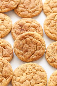 several cookies are arranged in rows on a white surface