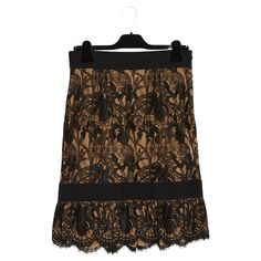 Emilio Pucci skirt in black viscose lace, straight cut decorated with a low ruffle, all mounted on flesh-colored silk crepe, high waist on a wide black elastic ribbon, fastening with a long zip on the side. Size 42FR (better in 40FR): waist 39 cm, hip 48 cm, length 60 cm. Everything is elastic and therefore comfortable, in addition to being super feminine and chic. Elegant Skirt Bottoms With Lace Patchwork, Formal Lace Lined Skirt Bottoms, Formal Lace Skirt, Chic Formal Skirt With Lace Trim, Evening Lace Skirt With Ruffles, Elegant Black Bottoms With Contrast Lace, Elegant Tiered Skirt With Lace Trim, Elegant Fitted Skirt With Contrast Lace, Formal Black Lace Bottoms