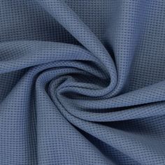 a blue fabric with small squares on the top and bottom, it is very soft