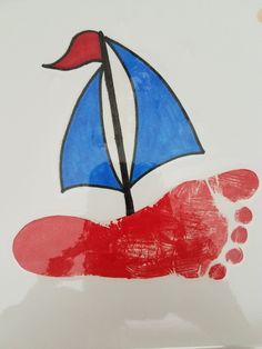 a child's hand painted with red, white and blue colors holding an umbrella