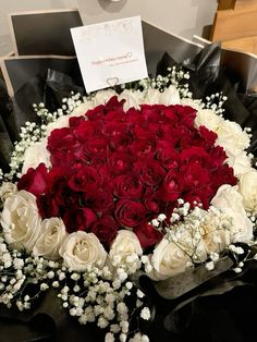 a large bouquet of red and white roses