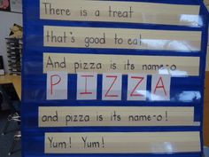 there is a piece of paper taped to the wall with words written on it that read,'there is a treat that's good to eat and pizza is its named