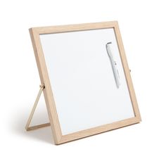 a wooden frame with a pen on it