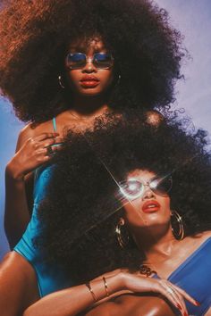 two beautiful women in swimsuits and sunglasses posing for a magazine cover with an afro hairstyle