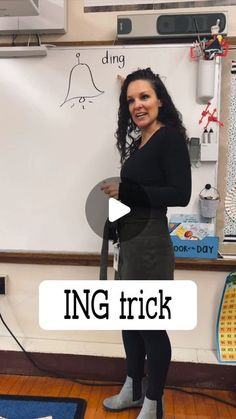 a woman standing in front of a whiteboard with the words ing trick written on it