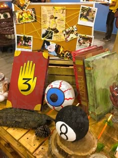 there are many items on the table with numbers and pictures around them, including balls