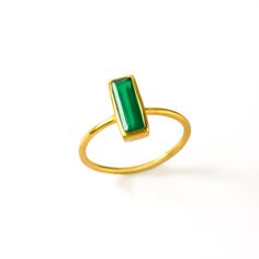 "Breaking new ground with this Adira Series dainty gemstone bar rings. This modern bar ring features carefully faceted rectangular Green Onyx. Perfect for weddings, bridal parties, everyday, date night, and birthdays! Gemstone is approximately 10 x 3 mm (0.3 x 0.1 inches). This ring is available in different US SIZES ✦ Size 6 ✦ Size 7 ✦ Size 8 ✦ Size 9 Metal ✦ 18K Yellow Gold Plated over Sterling Silver ✦ 18K Rose Gold Plated over Sterling Silver ✦ Sterling Silver THIS RING IS AVAILABLE IN A VAR Modern Jewelry With Rectangular May Birthstone, Modern Rectangular May Birthstone Jewelry, Modern Rectangular Emerald Ring For May Birthstone, Modern Rectangular Birthstone Ring, Rectangular Ring For May Birthstone, Gift Emerald Ring With Rectangular Stone, Modern Emerald Cut Stackable Rings Gift, Modern Stackable Emerald Ring For A Gift, Modern Stackable Emerald Ring As A Gift