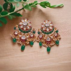 Silver Moissanite Polki Chandbali Earring, Emerald Earring, Kundan Chandbali, Bridal Chandbali Earring, Traditional Jewellery, Chandbali *𝐀𝐛𝐨𝐮𝐭 𝐏𝐫𝐨𝐝𝐮𝐜𝐭* Product Code :- TE 1035 Product Type :- Chandbali Earring Product Weight :-  Gemstone Used :- Moissanite Polki, Labmade Emerald & Ruby Material :- 925 Sterling Silver, Moissanite Polki, Labmade Emerald & Ruby, Enamel Size :- 5.5x3 Cm Intricate, hand-crafted, Pure Silver Polki Earrings, studded with high-quality Moissanite Polki comes with Push back, made in 92.5 silver with 22ct gold plating. The product comes with 92.5 silver stamping -Product can be made in gold as well. -If any product is not ready, It takes 2-3 weeks to make in pure silver -We also look forward to Bulk Orders. We shall consider special discount on Bulk Orde Green Earrings For Reception And Festivals, Green Earrings For Reception And Festive Occasions, Traditional Green Round Pearl Earrings, Traditional Meenakari Pearl Earrings For Reception, Green Cutdana Earrings For Wedding, Green Latkans Earrings For Reception, Traditional Green Earrings For Reception, Green Bridal Earrings For Reception And Festivals, Traditional Green Pearl Earrings For Celebrations