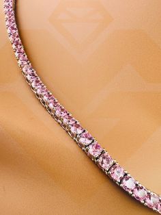 Introducing our Sparkly Pink Tennis Chain, a dazzling and vibrant accessory that transcends conventional jewelry. This exquisite piece is designed for both men and women who crave a touch of flamboyance in their style. The focal point of this tennis necklace is the VVS Fiery Pink Gemstones, which emulate the brilliance of genuine diamonds, creating a stunning and eye-catching display. Crafted with meticulous attention to detail, the simulated diamonds on this tennis chain rival the sparkle of re Pink Tennis, Tennis Chain, Diamond Chain, Tennis Necklace, Pink Gemstones, Pink Sapphire, Gold Vermeil, Focal Point, Tennis