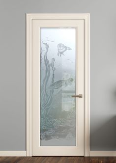 a white door with frosted glass on the front and side panels in an empty room