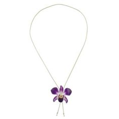 Resplendent in jewelry a natural dendrobium orchid is forever preserved in resin to share its beauty. Danai accentuates the Thai blossom with 22k gold and displays the pendant on a slender brass chain bathed in gold. Because natural blossoms are used size and shape will vary slightly. Elegant Orchid Flower Jewelry, Orchid Flower Pendant Jewelry Gift, Orchid Flower Pendant Jewelry For Gift, Orchid Flower Necklace For Gift, Elegant Adjustable Necklace With Pressed Flowers, Elegant Adjustable Necklaces With Pressed Flowers, Dendrobium Orchid, Dendrobium Orchids, Resin Pendant Necklace