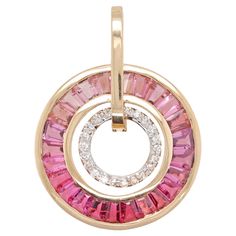 18k gold pink tourmaline taper baguettes diamond circle art deco pendant necklace This 18 karat gold stunning pendant is a mesmerizing blend of sophistication and grace, where lustrous pink tourmalines are circularly complimented with brilliant cut diamonds. Skillfully crafted, this pendant features ombre shades of vibrant pink tourmalines taper cut and channel set to perfection in a seamlessly circular pattern. At the heart of the pendant surrounding the tourmaline, the diamonds form a delicate halo, adding a touch of celestial sparkle and refinement to the design. Pair this pendant with matching earrings any time of the day for any occasion. Details: Metal: 18K Yellow Gold using international alloys Gemstone: Natural Pink Tourmalines & Diamonds Gross wt: 5.72g CS wt: 2.41 cts Dia wt: 0.2 Luxury Pink Gold Round Pendant Jewelry, Art Deco Pendant Necklace, Art Deco Pendant, Necklace Indian, Circle Pendant Necklace, Circle Diamond, Circular Pattern, Circle Art, Art Deco Diamond