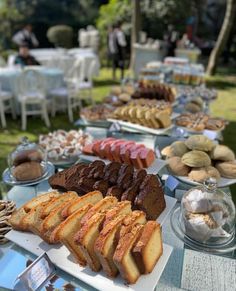 a table filled with lots of different types of pastries and desserts on it