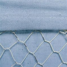 a close up view of a net with blue fabric