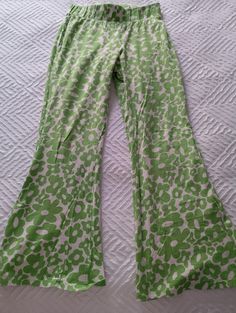 Fun hippy Shake trousers/ flares with elasticated waist. Super comfy! Green and white floral design.  Size medium UK 10/12 inside leg 62cm Full length 85 cm Excellent condition Trendy Green Printed Pants, Spring Green Printed Pants, Green Printed Wide-leg Pants, Green Cotton Bottoms With Floral Print, Green Floral Print Cotton Bottoms, Green Bohemian Bottoms With Floral Print, Spring Patterned Stretch Bottoms, Green Bohemian Floral Print Bottoms, Bohemian Green Floral Print Bottoms