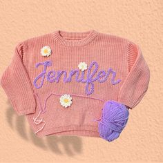 Newborn Gifts, Personalized Baby Sweater, Hand Embroidered Sweatshirt Baby, Baby Christmas Gifts, Kids Gifts, Baby Shower Gifts For Girls This embroidered knit sweater--an ideal choice for celebrating the journey into motherhood or commemorating a baby shower. Crafted with exquisite attention to detail, this sweater combines warmth with timeless style, making it suitable for gifting on birthdays, during the festive season, and throughout the transitional seasons of Winter, Autumn, and Spring. Its versatile nature ensures it's not just a garment but a cherished keepsake for both mother and child. ABOUT THIS ITEM: PERSONALIZED: You can custom name on your sweater. Let's add the name in personalized box and creat special gifts for loved one. MATERIAL: This knit sweaters are made with high-qua Hand Embroidered Sweatshirt, Baby Christmas Gifts, Baby Sweater, Baby Christmas, Knit Sweaters, Gifts Baby, Gifts Personalized, Embroidered Sweatshirt, Baby Sweaters