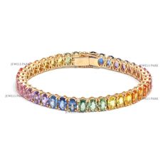 Rainbow sapphire oval tennis bracelet in 14K gold | Natural rainbow oval cut bracelet gold | Colorful rainbow sapphire gift for occasion GEMSTONE DETAILS : ✦ Gemstone : Rainbow Sapphire ✦ Gemstone Type : Natural ✦ Gemstone Size : 6x4MM ✦ Gemstone Shape : Oval ✦ Number of Gemstones : 35 ✦ Gemstone Weight : 23 carats ✦ Gemstone Grade : AAA METAL DETAILS : ✦ Metal : 14K/18K Gold ✦ Metal Color : Yellow / White / Rose Gold ✦ Setting : Prong Setting ✦ Bracelet Box : Yes SHIPPING DETAILS : ✦ Shipped vi Rainbow Colored Oval Jewelry, Rainbow Sapphires, Custom Wedding Band, Bracelet Box, Rainbow Bracelet, Sapphire Bracelet, Natural Rainbow, Colorful Rainbow, Sapphire Gemstone