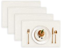 three placemats with silverware on them and a white plate topped with food