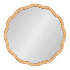 a round mirror that is made out of wood and has a wicker frame around it