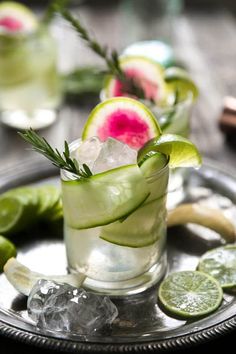 two glasses filled with watermelon, cucumber and mint garnish