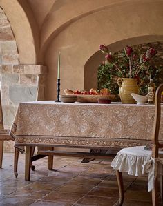 a dining room table with a vase on it