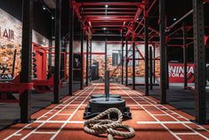 a rope is on the ground in an empty gym