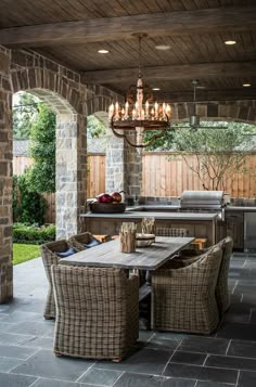 an outdoor kitchen and dining area is shown