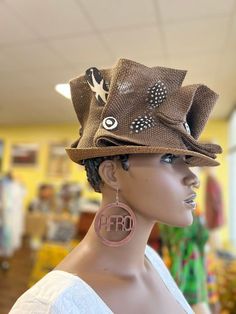 This is for the bold and beautiful. A wearable art collection also known as Hatitude. A Zulu hat that is sure to make a statement.  Hand painted Prosperity symbols to attract wealth and abundance. Inspired by the Zulu women of Johasurburgh, Africa. This can be form to ethnic formal occasions or to street festivals . Head circumference 24 inches,2 inches brim, and 3 inches in-depth.You can have it both ways . Don't delay order yours today. Adjustable Handmade Brown Cloche Hat, Unique Handmade Brimmed Mini Hats, Unique Brown Hat With Curved Brim, Brown Handmade Mini Hats With Curved Brim, Handmade Brown Mini Hats With Curved Brim, Handmade Brown Cloche Hat With Wide Brim, Unique Handmade Brimmed Costume Hats And Headpieces, Unique Handmade Brimmed Costume Hat, Unique Adjustable Brown Hat