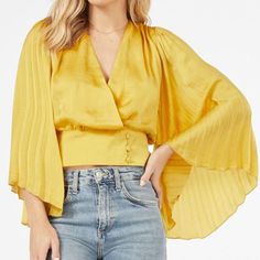 Posh Ambassador-Fast Shipper Same Day/Next Day Shipping Brand: Favlux Color: Sulphur Yellow Size: S (4/6) Bust: 34.5-35.5 Waist: 26.5-27.5 Flowy Pleated Sleeves Wrap Front Detail With Button Closure Fabric Type: 100% Polyester This Brand New Blouse Is Ready To Ship Out Today! Chic Yellow Cropped Blouse, Chic Yellow Cropped Tops, Chic Yellow Top For Brunch, Chic Cropped Yellow Tops, Chic Yellow V-neck Top, Gold Blouse For Spring Day Out, Elegant Yellow Blouse For Brunch, Elegant Yellow Tops For Brunch, Pleated Sleeves Blouse