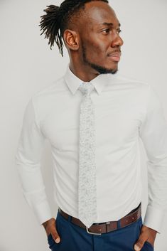 We pride ourselves in offering our customers some of the best skinny ties money can buy. Each DAZI tie is handmade from high quality imported fabrics. Features: Approx. 2.5" wide at the tip Approx. 58" in length 100% Cotton Fitted Cotton Suit And Tie Accessories, Dapper Fitted Standard Tie, Dapper Fitted Tie, Dapper Standard Tie, White Cotton Ties For Formal Occasions, Fitted Cotton Tie, White Tie For Work, Dapper Fitted Ties For Formal Occasions, White Standard Tie For Work