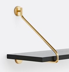 a black shelf with a gold handle on it