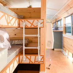 the bunk beds are made out of wood and have ladders on each side to keep them from falling